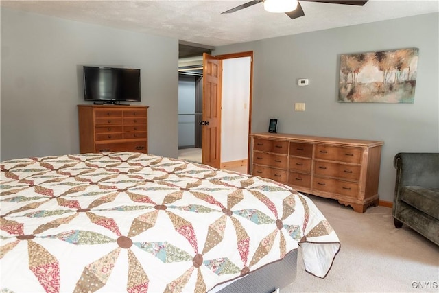 bedroom with light colored carpet and ceiling fan