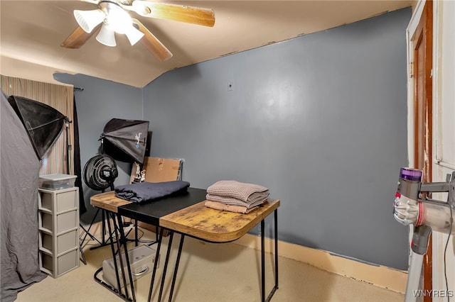 home office with a ceiling fan and vaulted ceiling