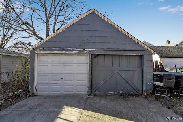 detached garage featuring central air condition unit