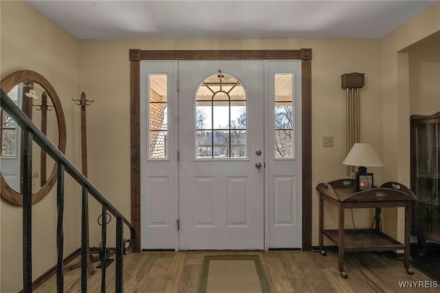 foyer entrance featuring wood finished floors