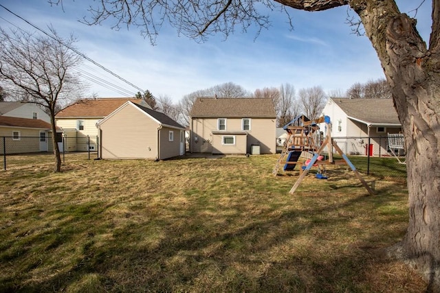 view of yard with a playground and fence