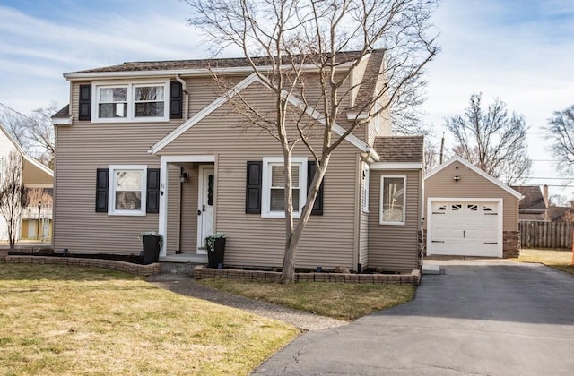 traditional home with driveway and a front yard