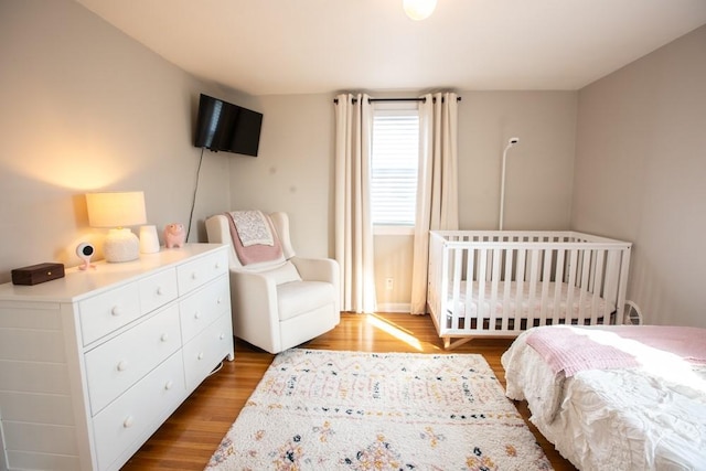 bedroom with wood finished floors