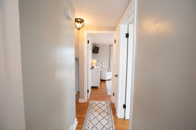 hallway featuring light wood finished floors