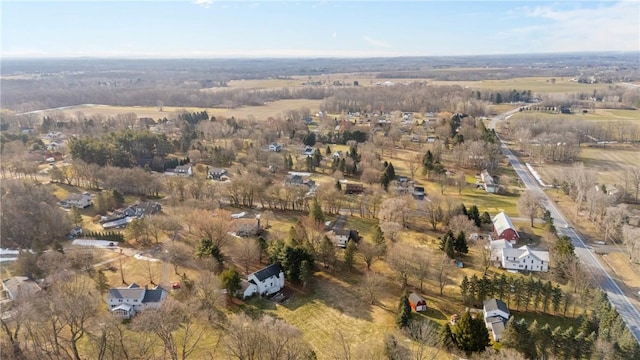 birds eye view of property with a rural view