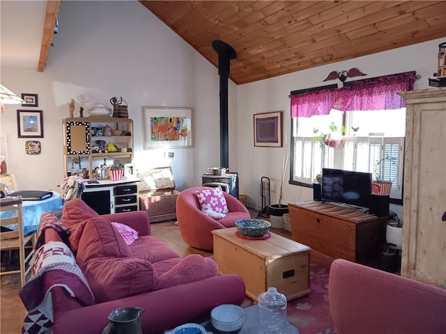 living room featuring wood ceiling, a wood stove, and vaulted ceiling