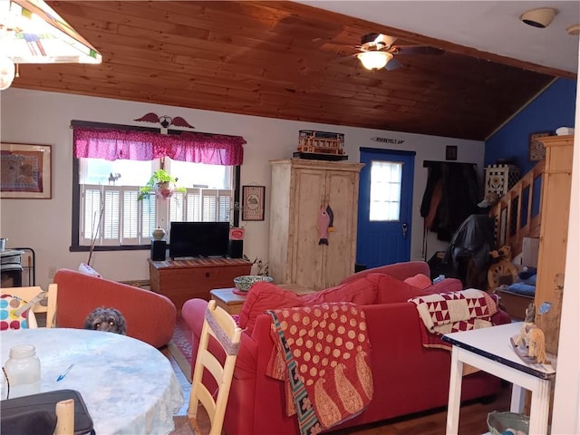 living room with lofted ceiling, a wealth of natural light, a ceiling fan, and wooden ceiling