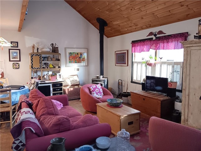 living room with wood finished floors, wood ceiling, a wood stove, and vaulted ceiling