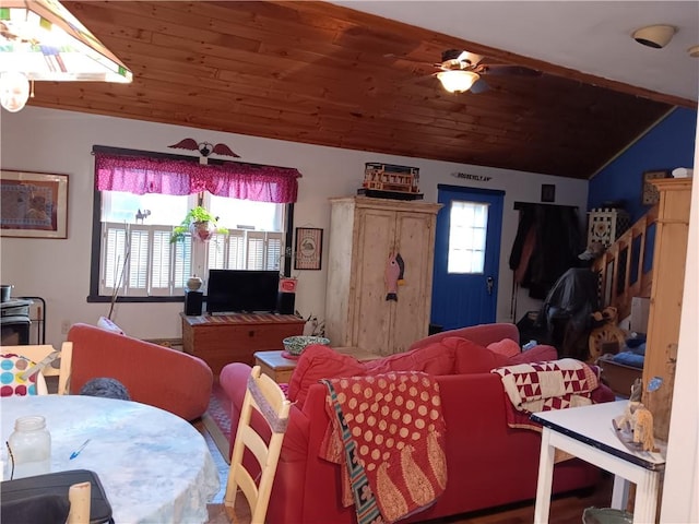 living area with wooden ceiling, a wealth of natural light, and lofted ceiling