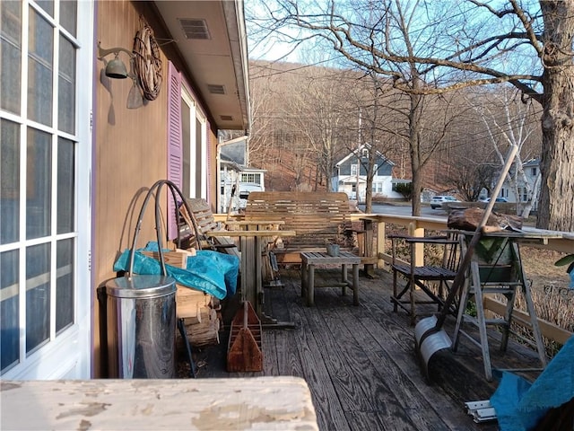 wooden deck with visible vents