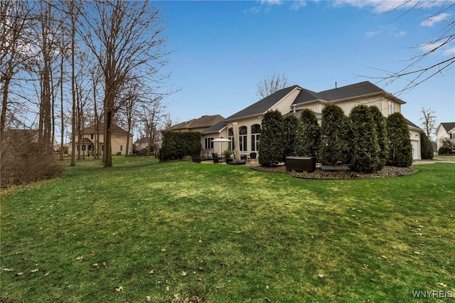 exterior space featuring a garage and a lawn