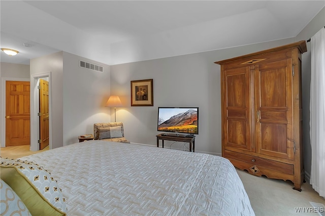 bedroom with light carpet and visible vents