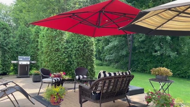 view of patio with a grill and a forest view