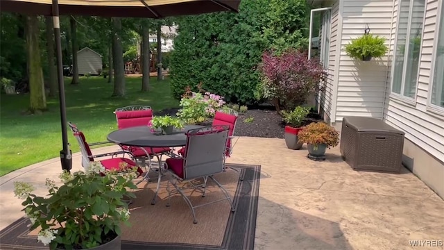 view of patio featuring outdoor dining area