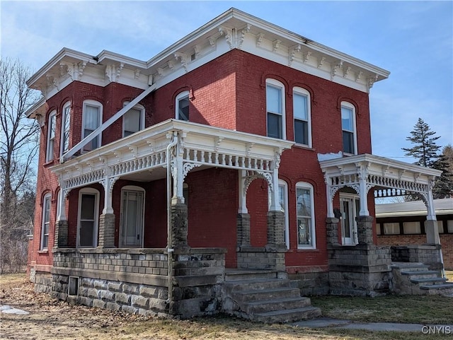 italianate house with a porch and brick siding