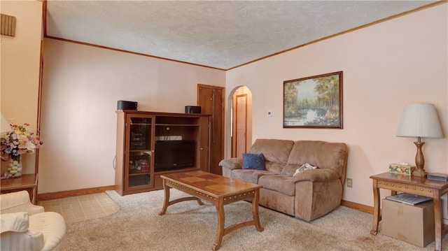 living room with baseboards, arched walkways, and crown molding