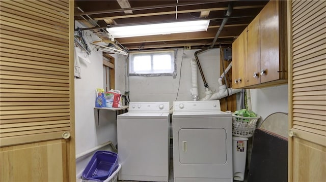 laundry room with cabinet space and separate washer and dryer