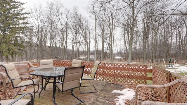 view of patio / terrace with outdoor dining area and a wooden deck