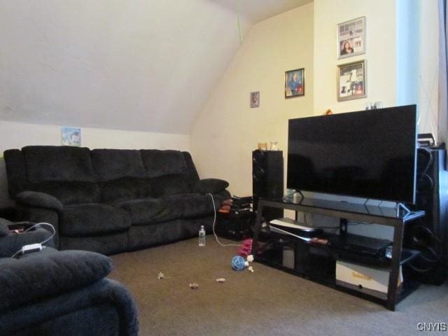 living area with lofted ceiling and carpet flooring