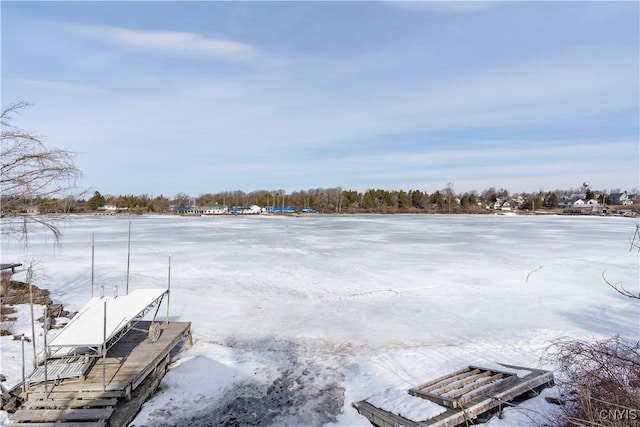 snowy yard with a boat dock