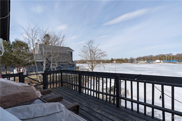 snow covered deck featuring area for grilling