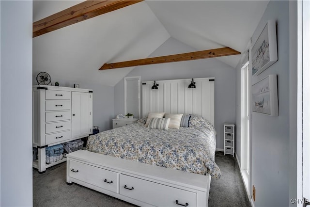 bedroom featuring lofted ceiling with beams and dark colored carpet