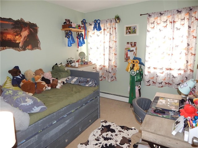 bedroom featuring a baseboard heating unit and carpet