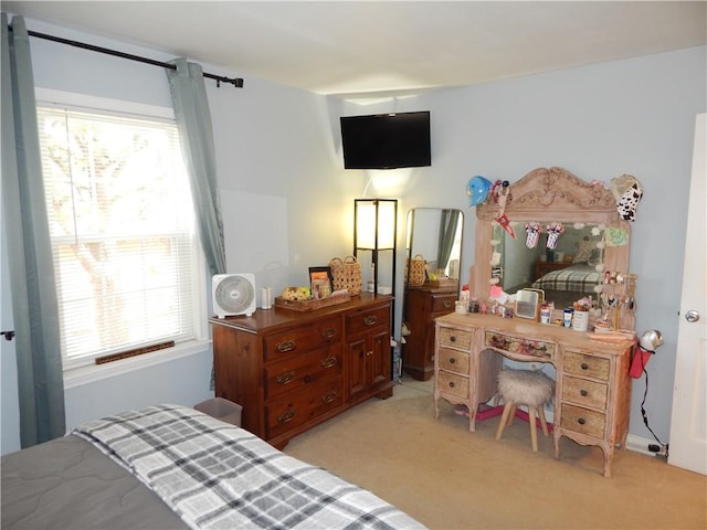 bedroom featuring light colored carpet