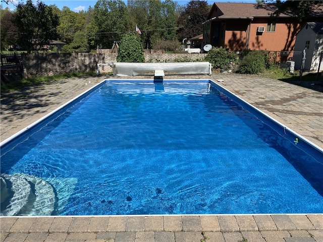 view of pool with fence