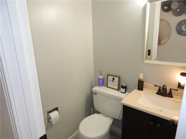 half bath with vanity and toilet