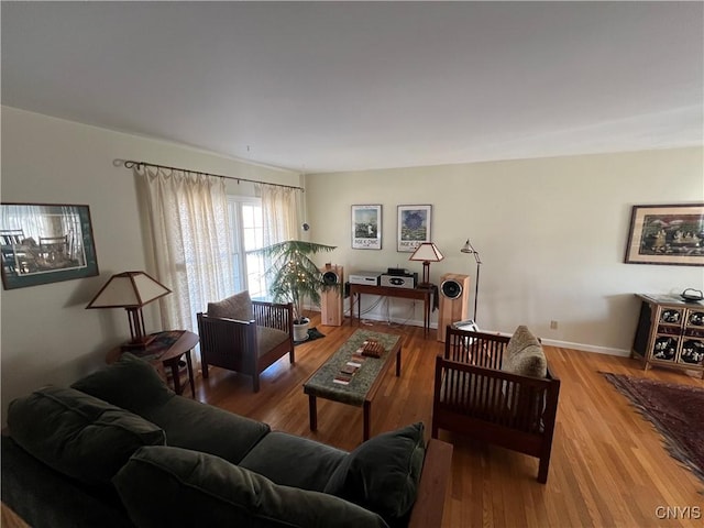 living area featuring wood finished floors and baseboards