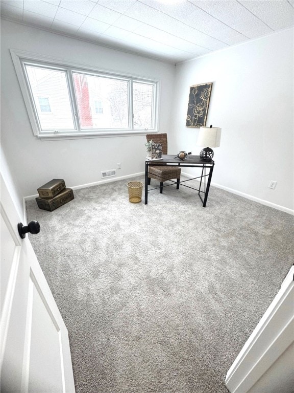 home office featuring carpet flooring, visible vents, and baseboards