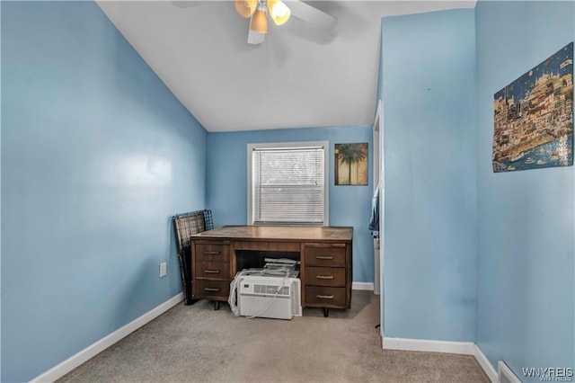 carpeted home office featuring lofted ceiling, baseboards, and ceiling fan