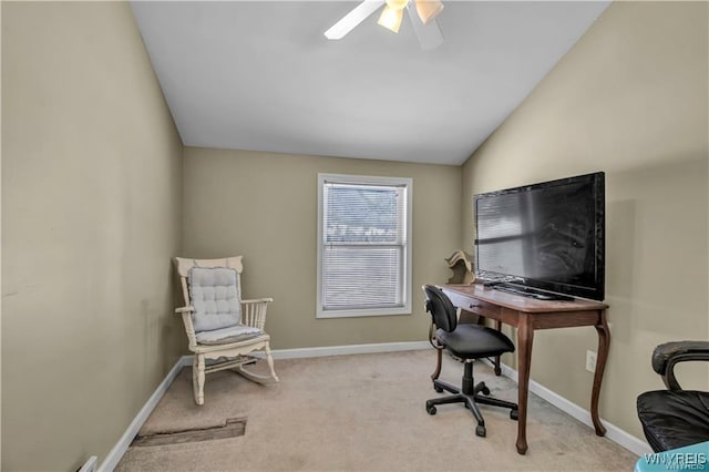 office area with lofted ceiling, carpet flooring, a ceiling fan, and baseboards