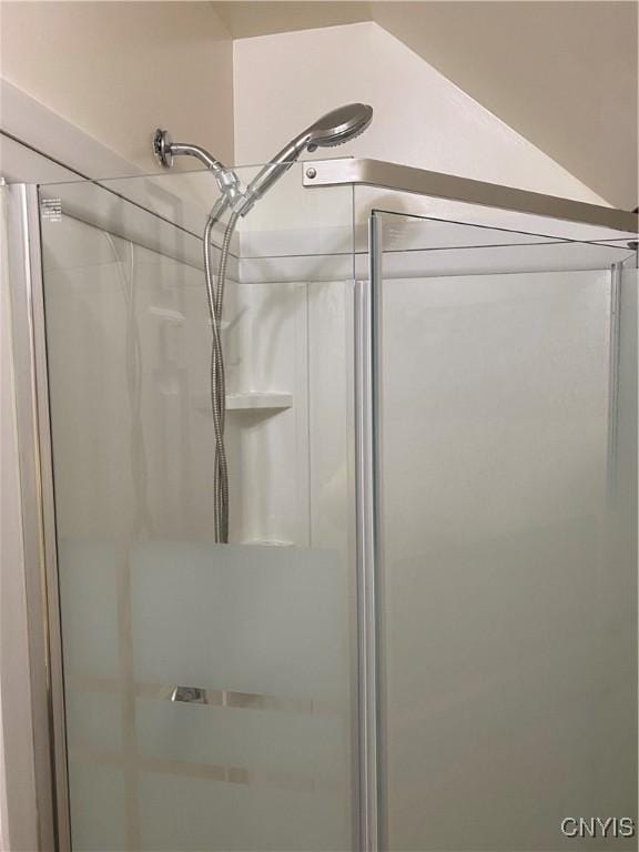 full bath featuring a shower stall