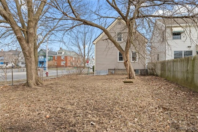 view of yard featuring a residential view and fence