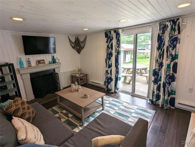 living room with hardwood / wood-style floors, wood ceiling, baseboard heating, and a fireplace