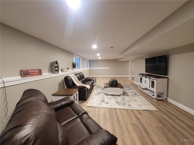 living area with recessed lighting, wood finished floors, and baseboards