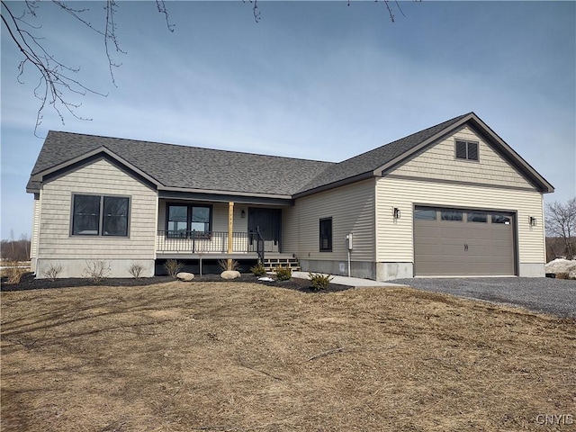 view of front of house with a porch, an attached garage, gravel driveway, and a shingled roof