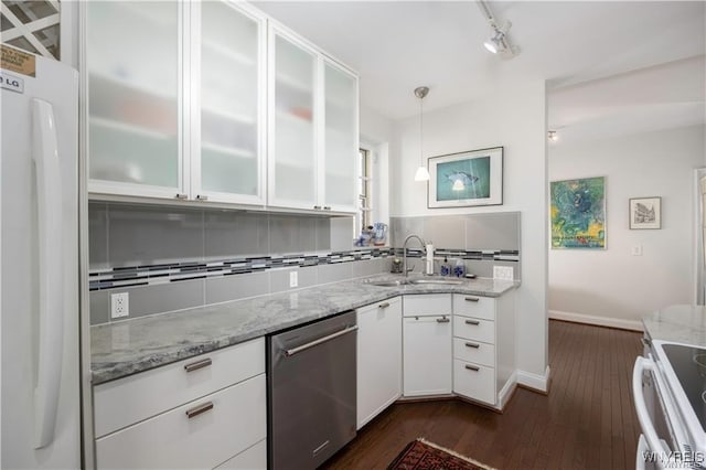 kitchen with range, stainless steel dishwasher, freestanding refrigerator, white cabinetry, and a sink