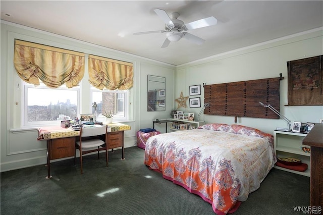 bedroom with carpet flooring, baseboards, crown molding, and a ceiling fan