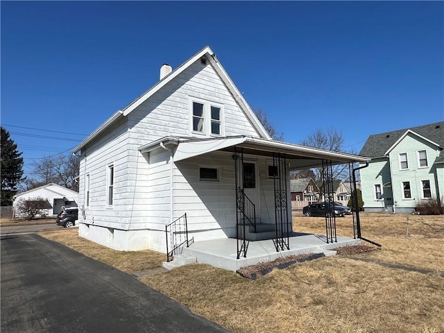 view of front of property with a chimney