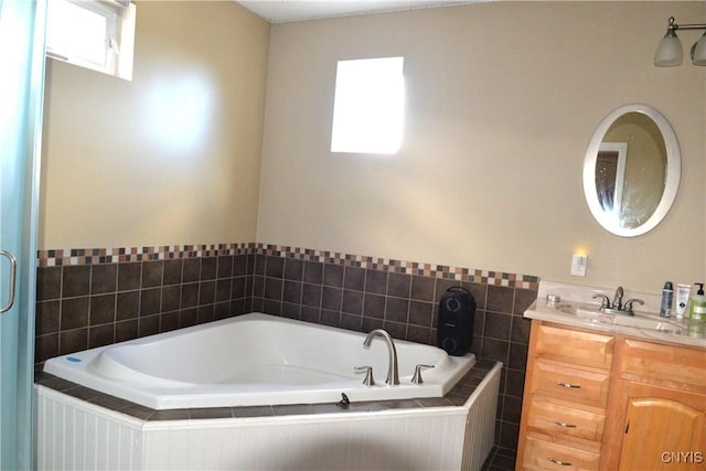 bathroom featuring a bath and vanity