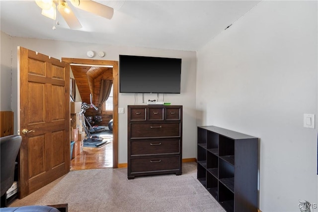 carpeted bedroom featuring ceiling fan and baseboards