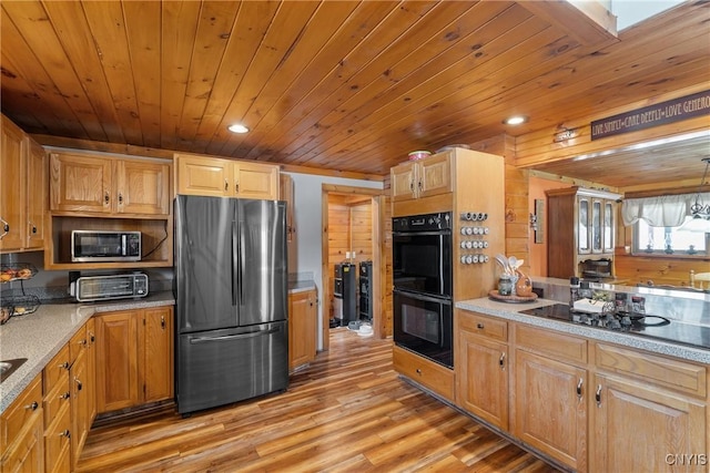 kitchen featuring light countertops, recessed lighting, wooden ceiling, light wood-style floors, and black appliances