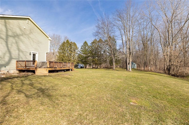 view of yard with a wooden deck