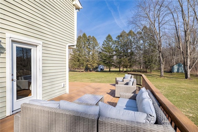 wooden deck with an outdoor hangout area and a lawn