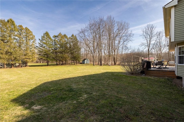 view of yard featuring a deck