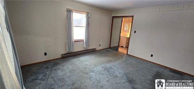 unfurnished bedroom featuring baseboards, baseboard heating, and carpet flooring