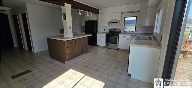 1620 Haskell Rd, Portville, NY 14760 - kitchen featuring extractor fan, light floors, light countertops, stainless steel gas range, and a sink